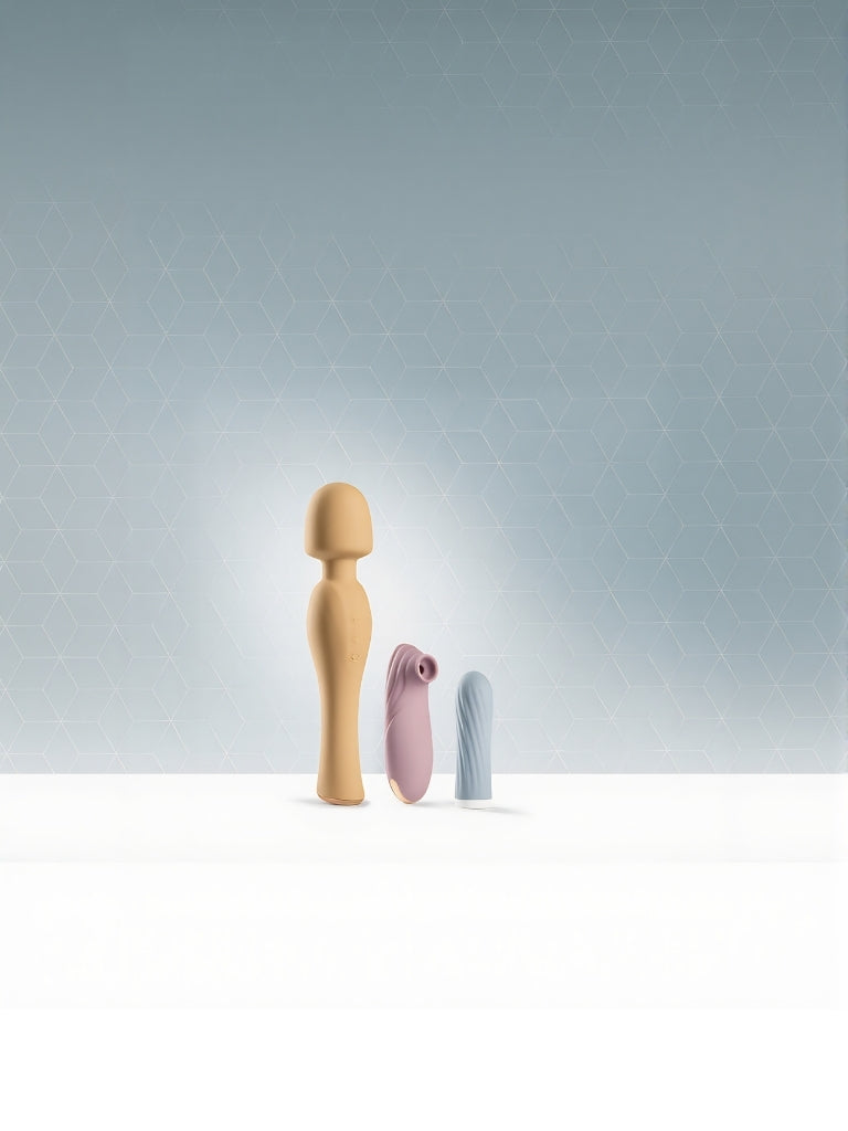 Minimalist display of three compact SmootherVibes vibrators against a geometric backdrop — wand, suction, and bullet models.
