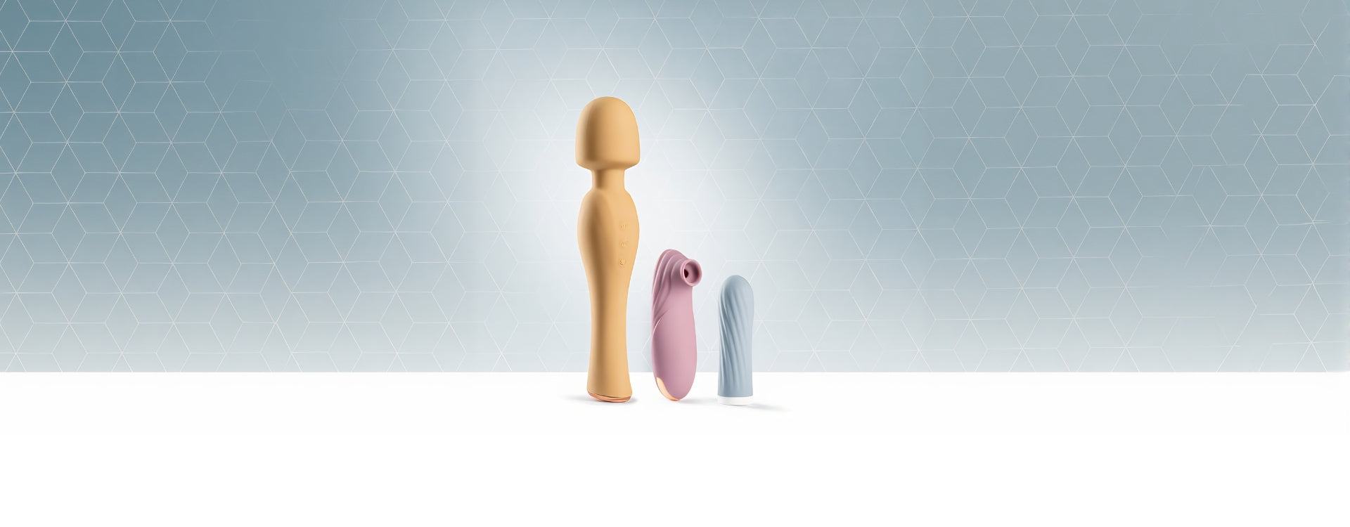 Trio of premium SmootherVibes vibrators — wand, clitoral suction, and bullet — displayed on a soft geometric background.